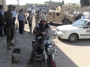 Me riding some kind of an Iraqi scooter